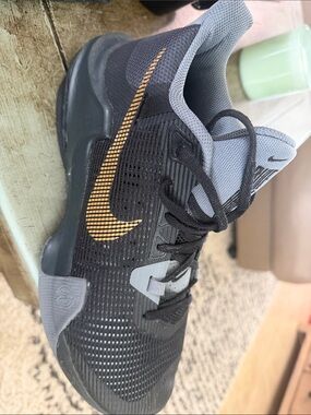 Nike Black and Gray Athletic Sneakers with Gold Swoosh
